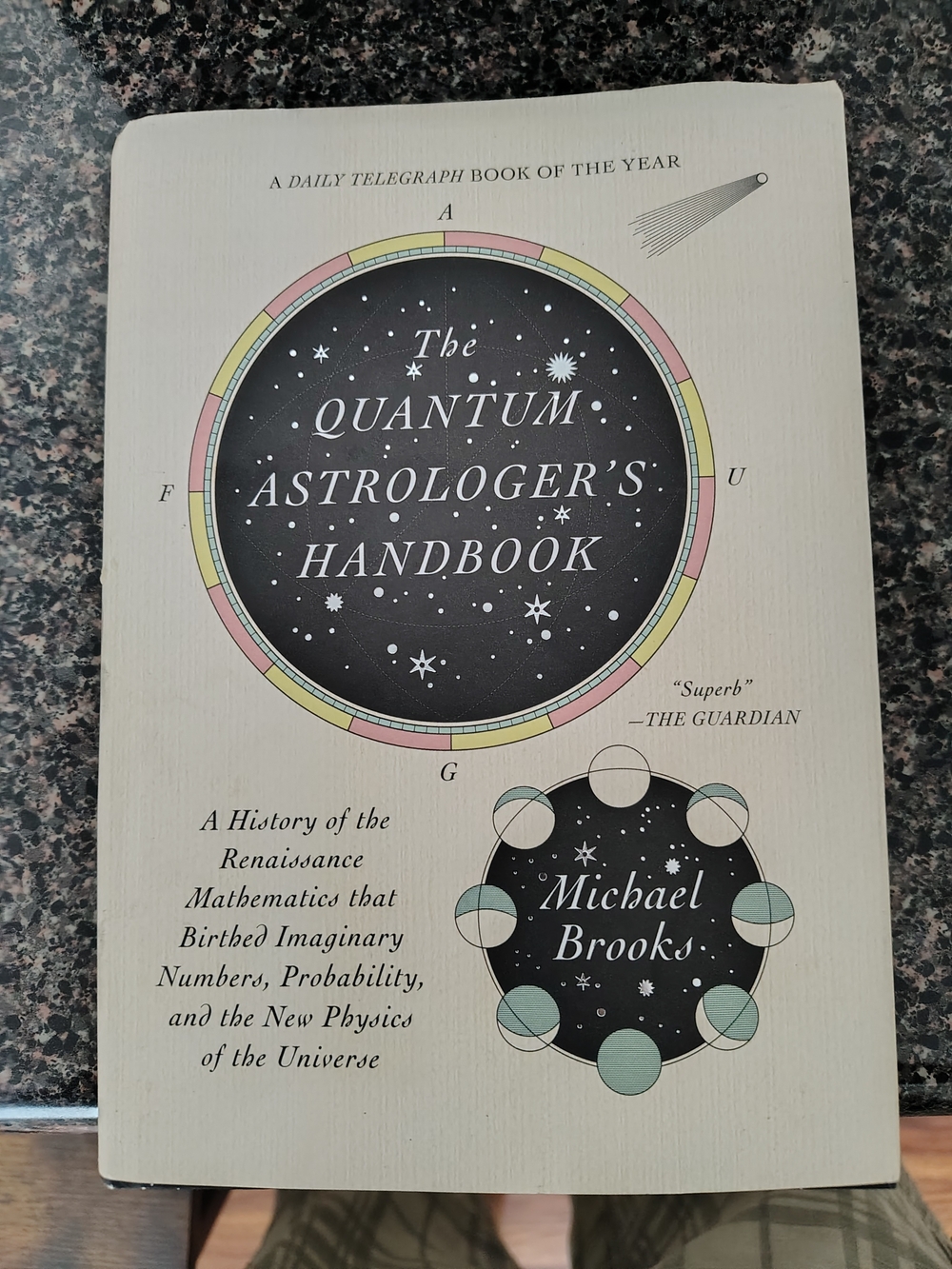 The Quantum Astrologer's Handbook by Michael Brooks - Cream Cover